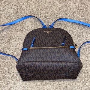 Im selling a Brown and Blue Michael Kors backpack bag!